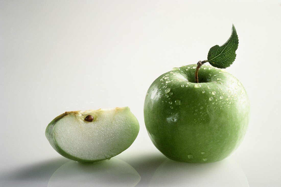 Whole Granny Smith Apple with Water Drops; Apple Slice