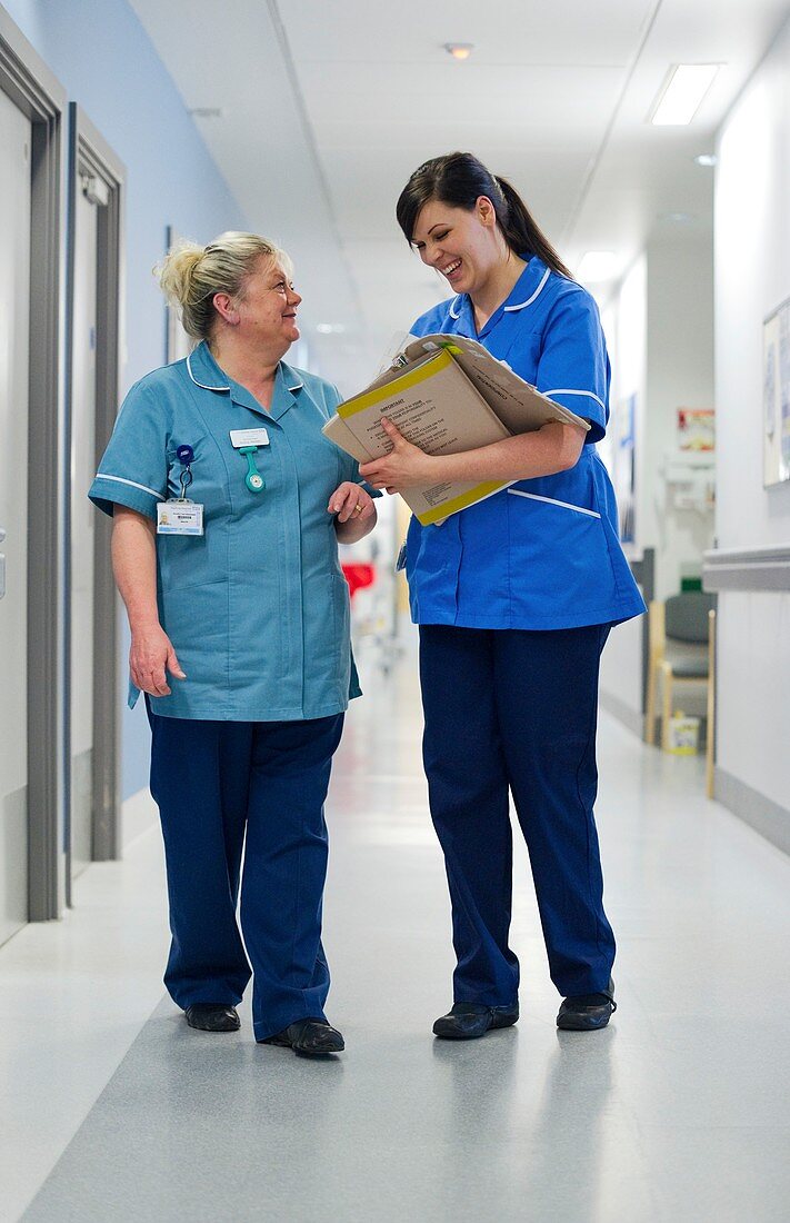 Nurses talking in corridor