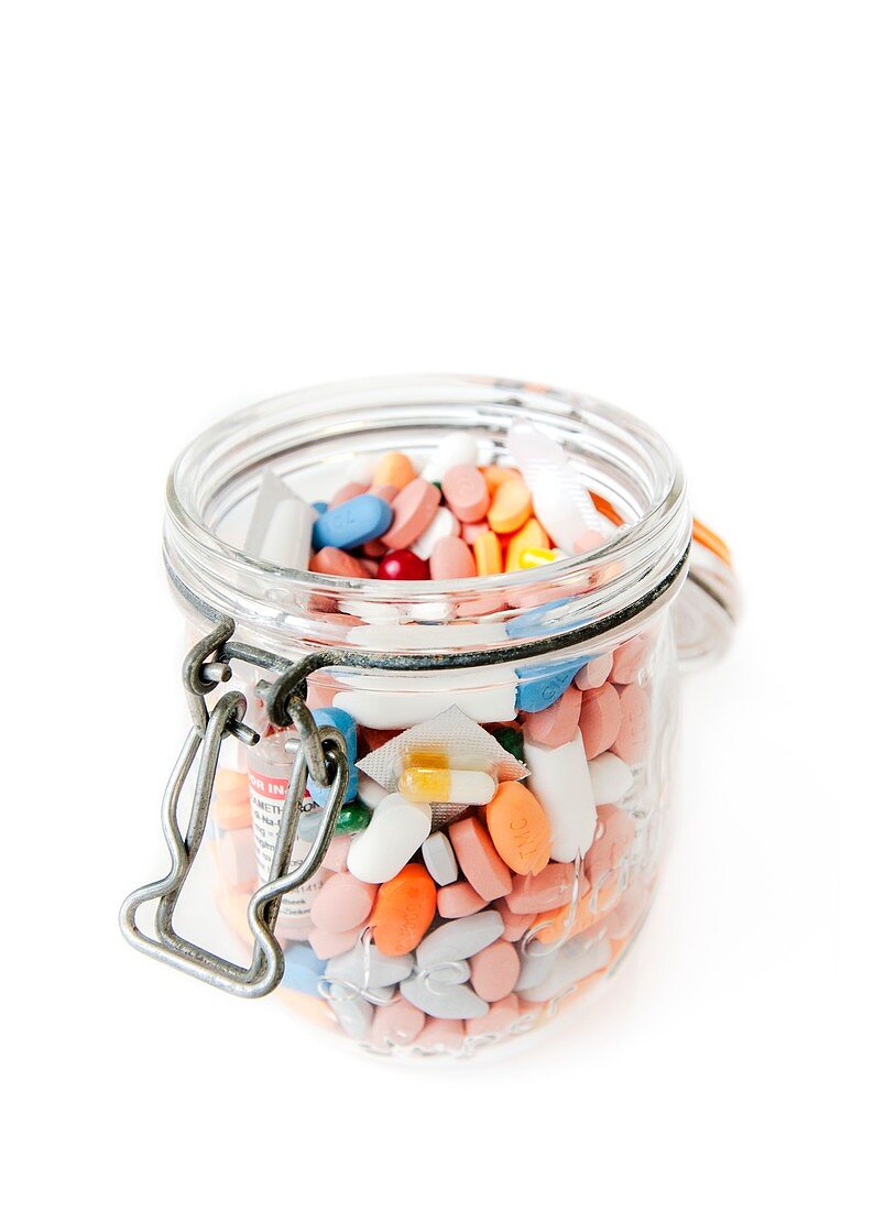 Assorted pills in a jar