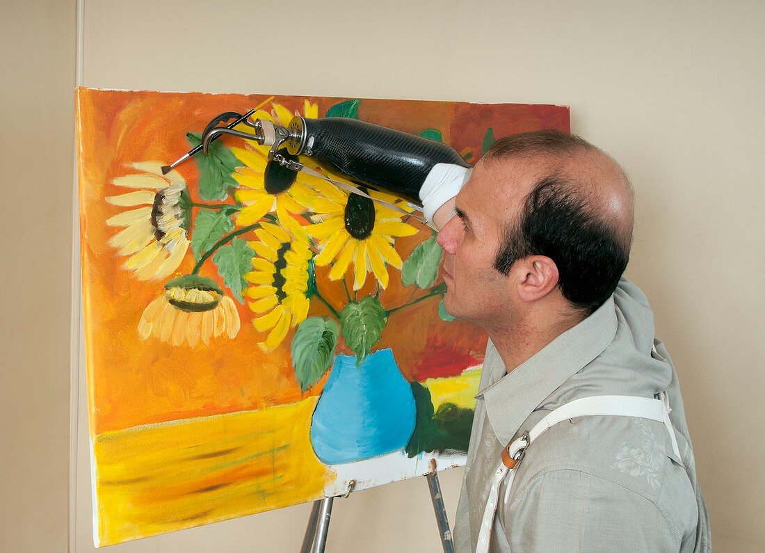 Amputee painting using prosthetic hand
