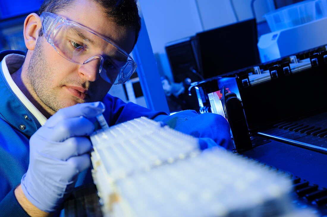 Scientist examining micro tube samples