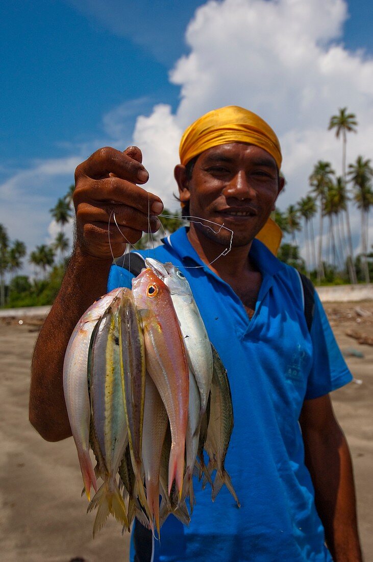 Fisherman with catch in Indonesia
