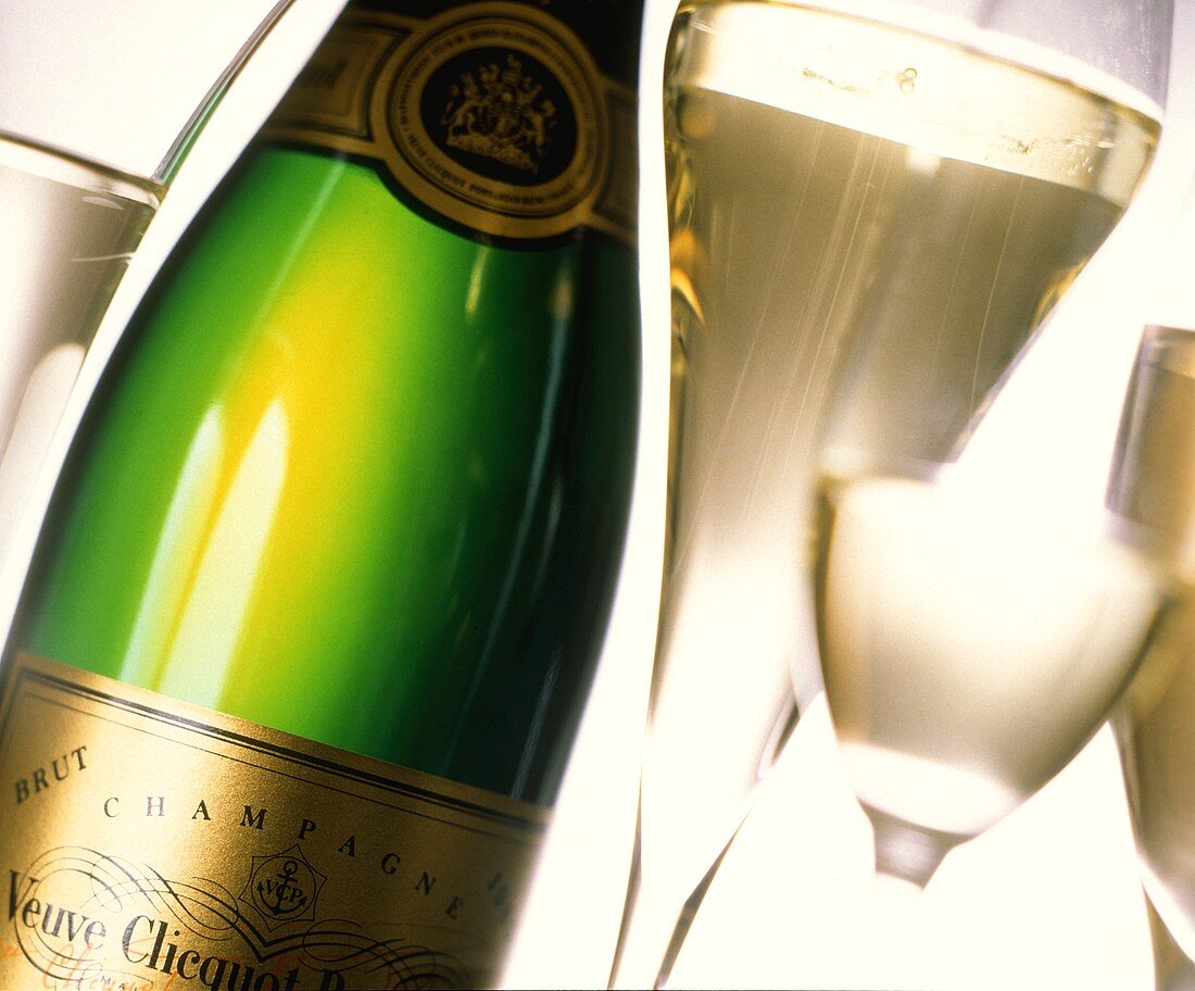 Champagne glass & bottle of Veuve Cliquot Brut in close-up