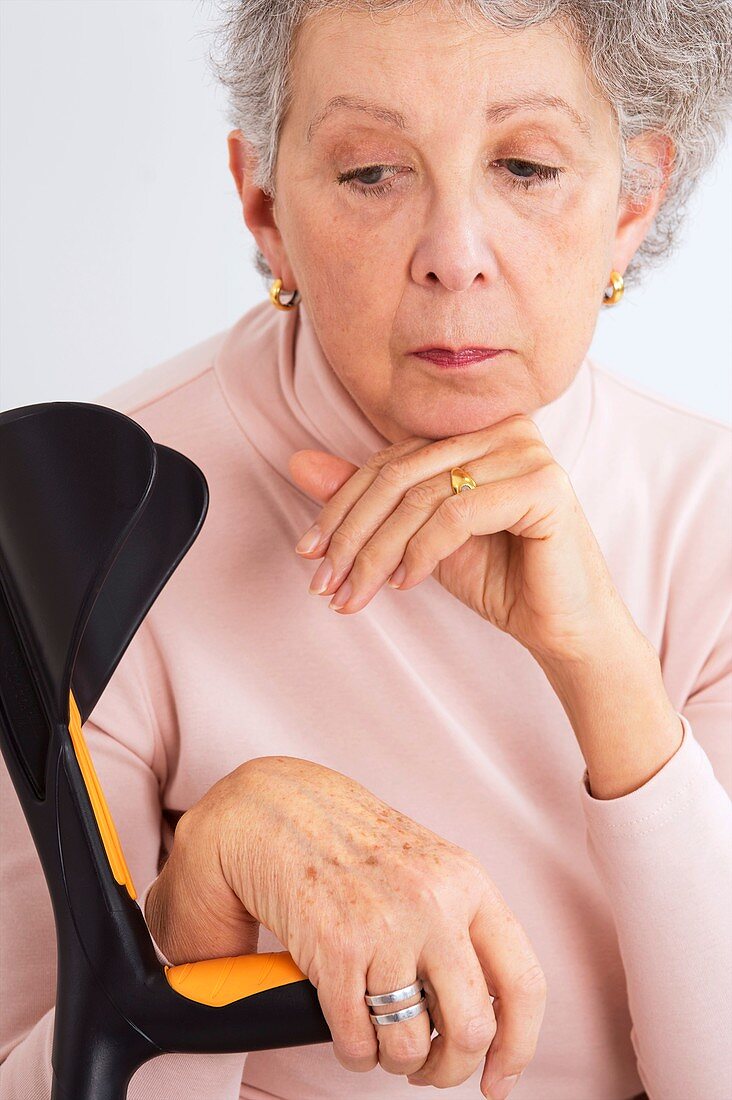 Senior woman with crutch