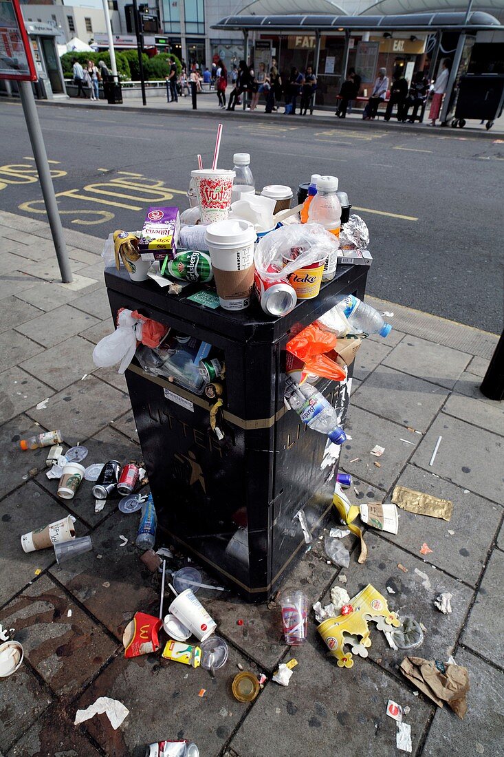 Overflowing litter bin