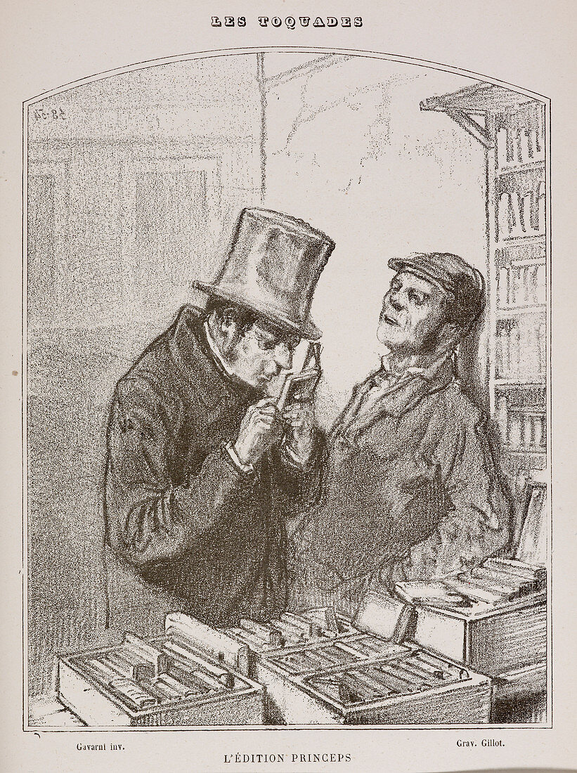 Two men in bookshop looking at the books