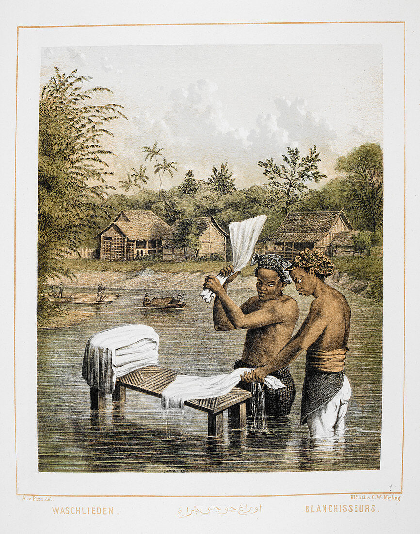 Two men washing laundry in a river