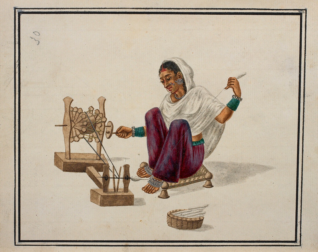 Woman spinning cotton