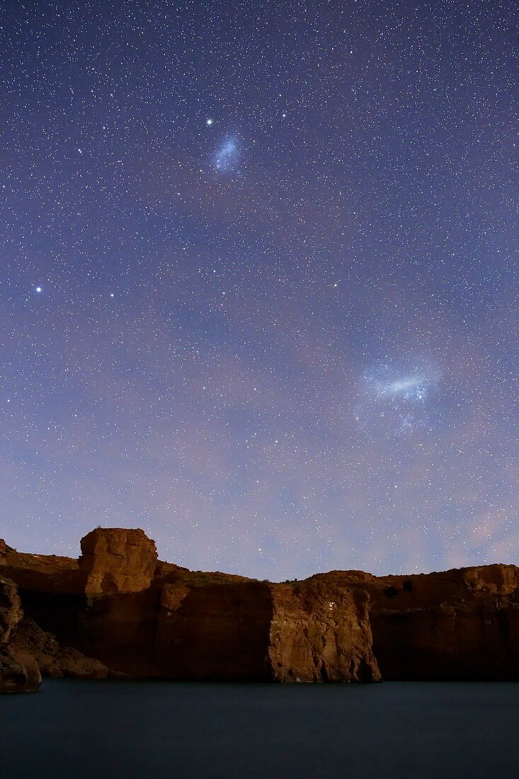 Magellanic Clouds over cliffs
