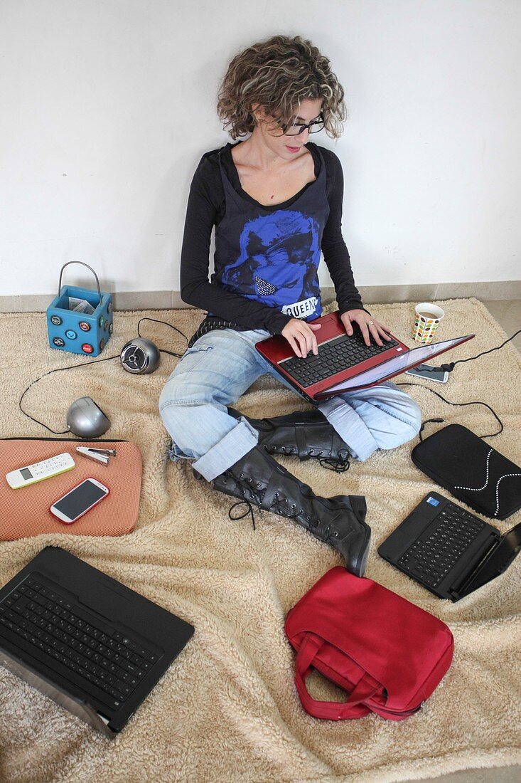 Young stylish woman works from home