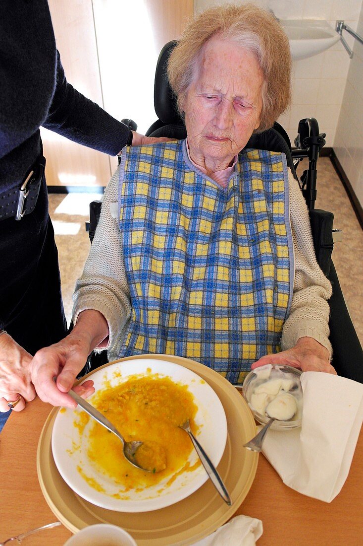 Alzheimer's patient being fed