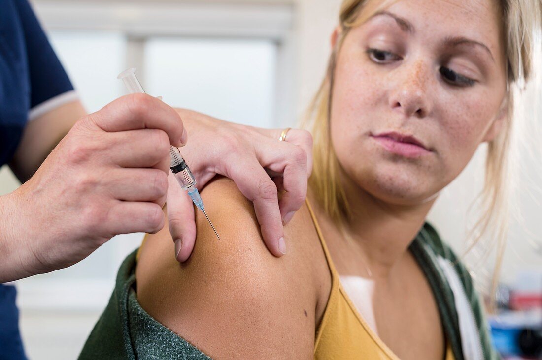 Nurse administering HPV vaccine