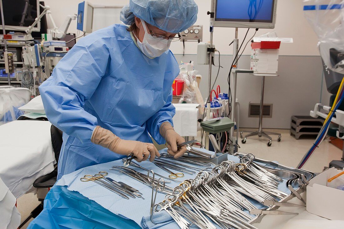Nurse preparing surgical instruments