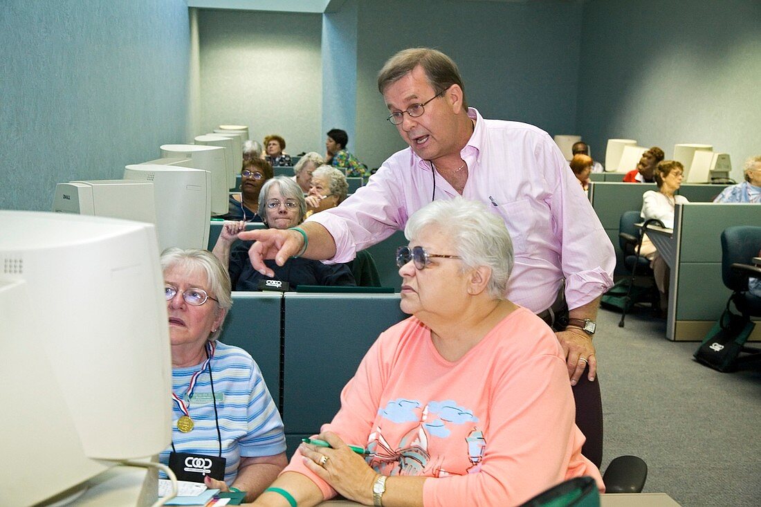 Senior citizens learning to use computers
