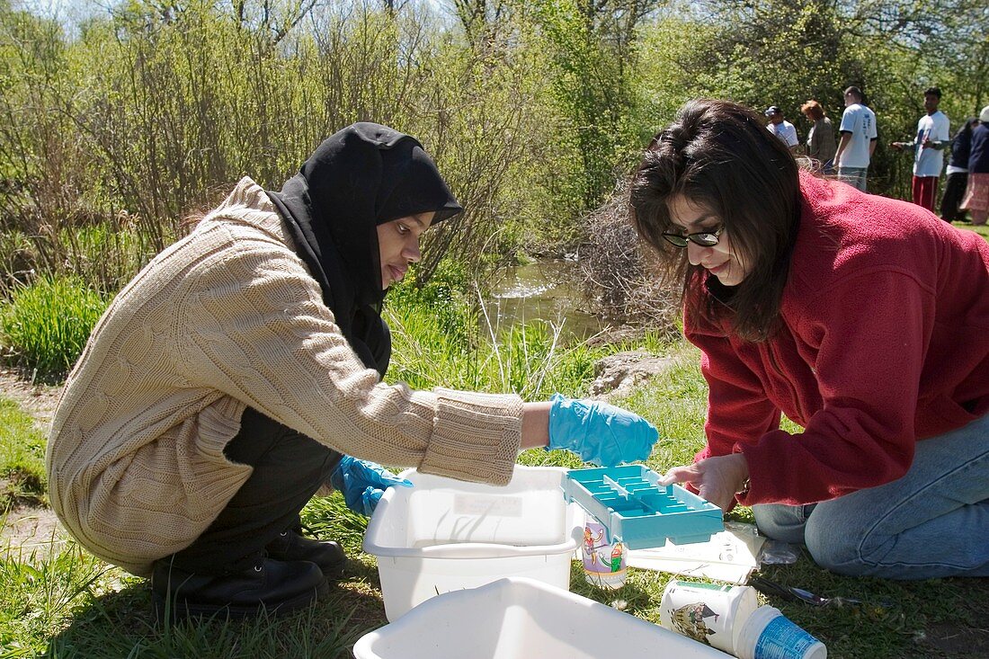 Students studying river water quality
