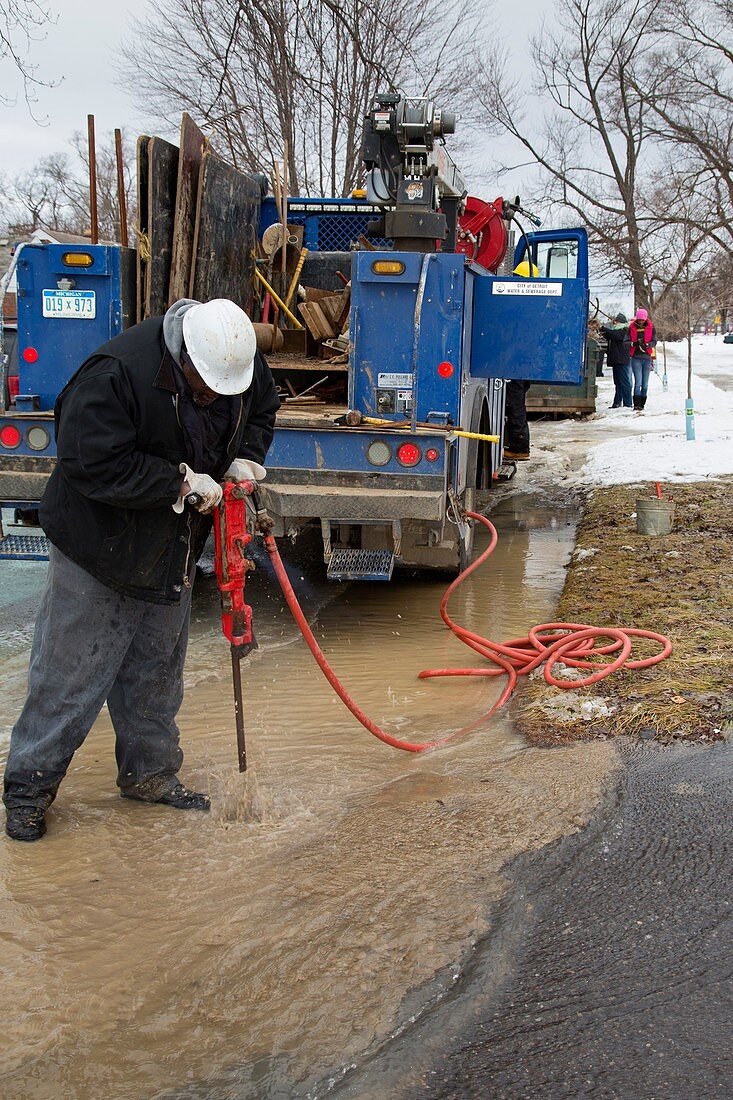 Worker repairing water mains