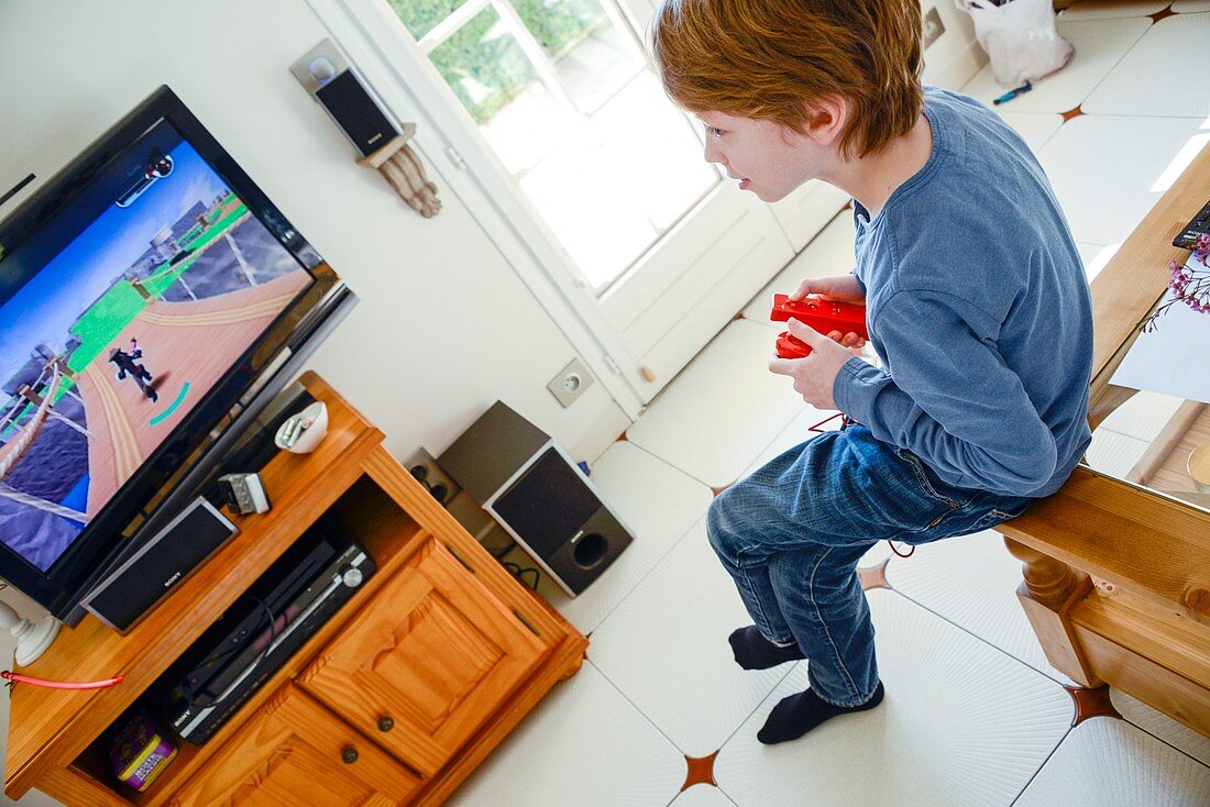 Boy playing Wii video game