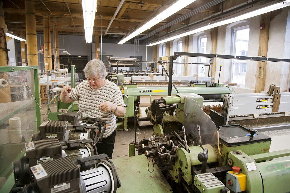 Textile mill loom operator