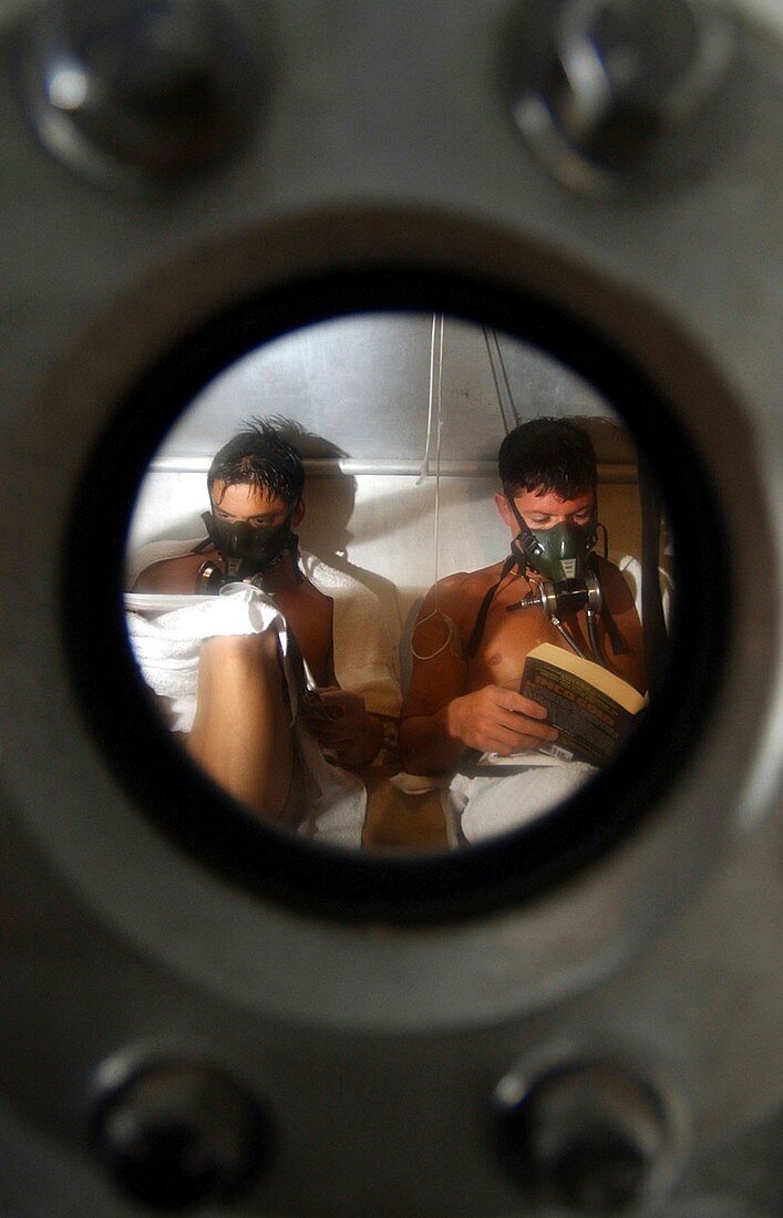 US Navy divers in a decompression chamber