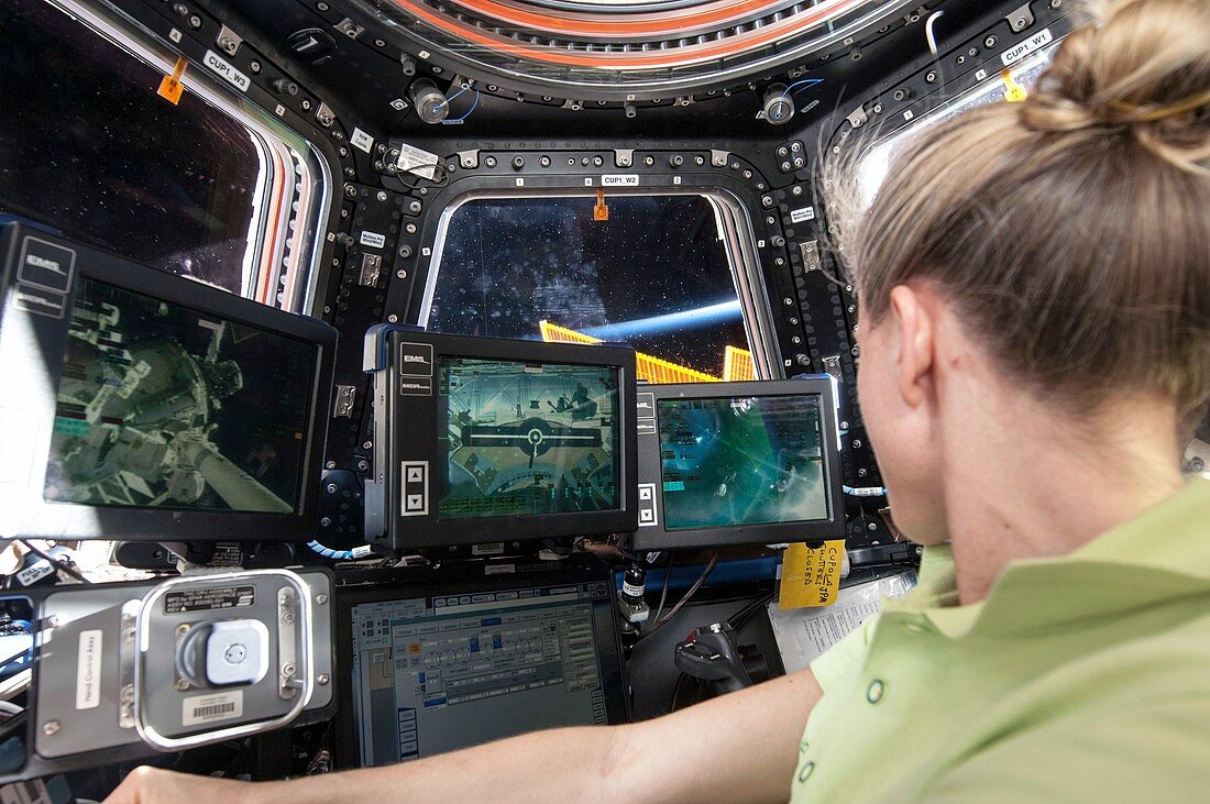 Astronaut in ISS robotics workstation