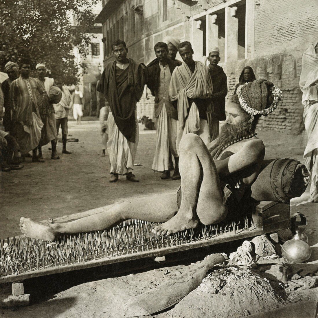Fakir on his bed of spikes,1900s
