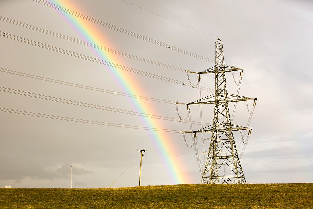 Rainbow over electricity pylons