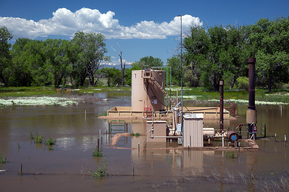 Oil well flooded by river,USA