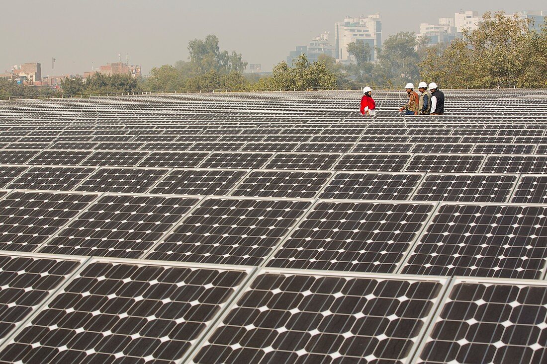 Workers at a 1 MW solar power station