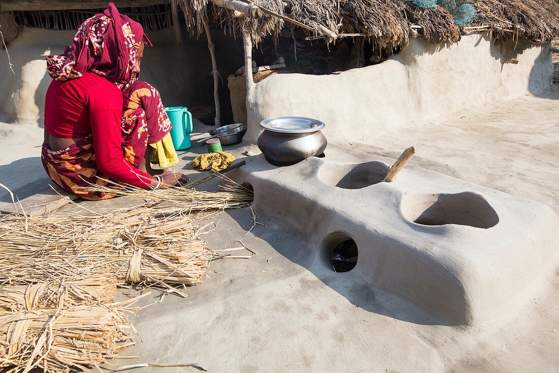 woman subsistence farmer cooking