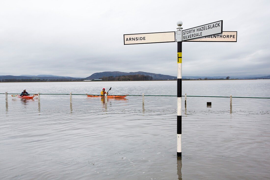 Kayakers in the flood waters