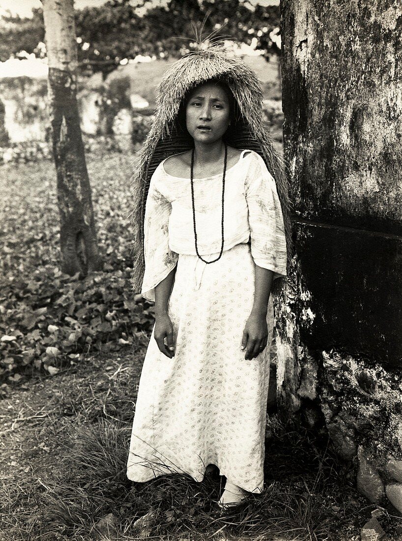 Filipino woman in traditional rain cape