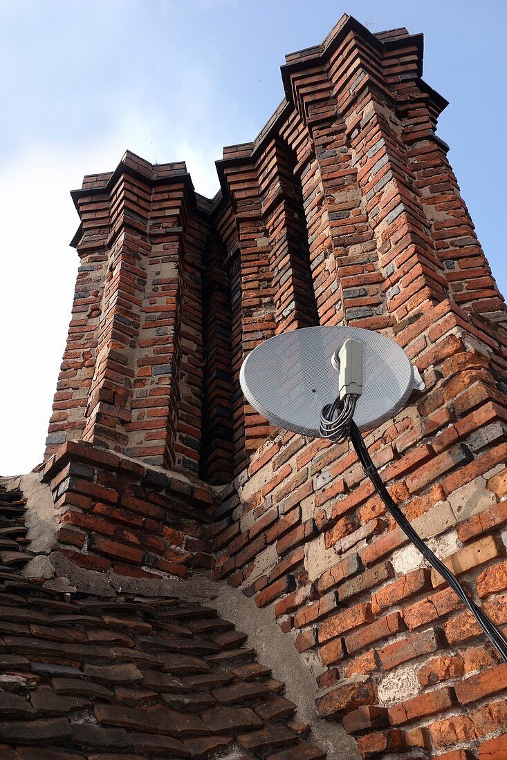 Tudor chimneys with satellite dish