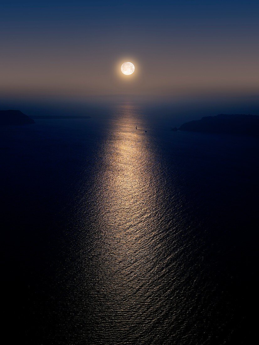 Moon setting over the ocean