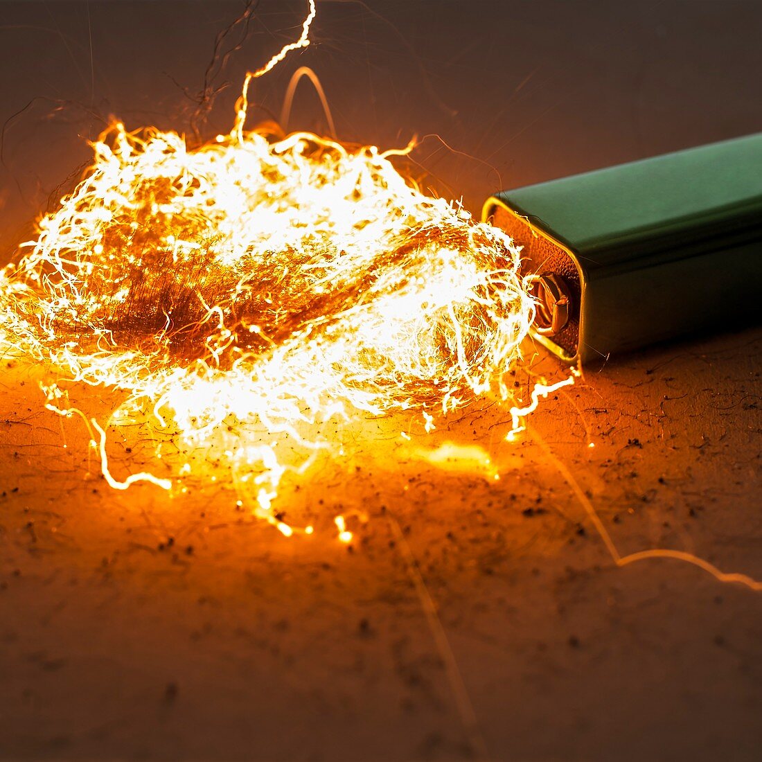 Battery and steel wool