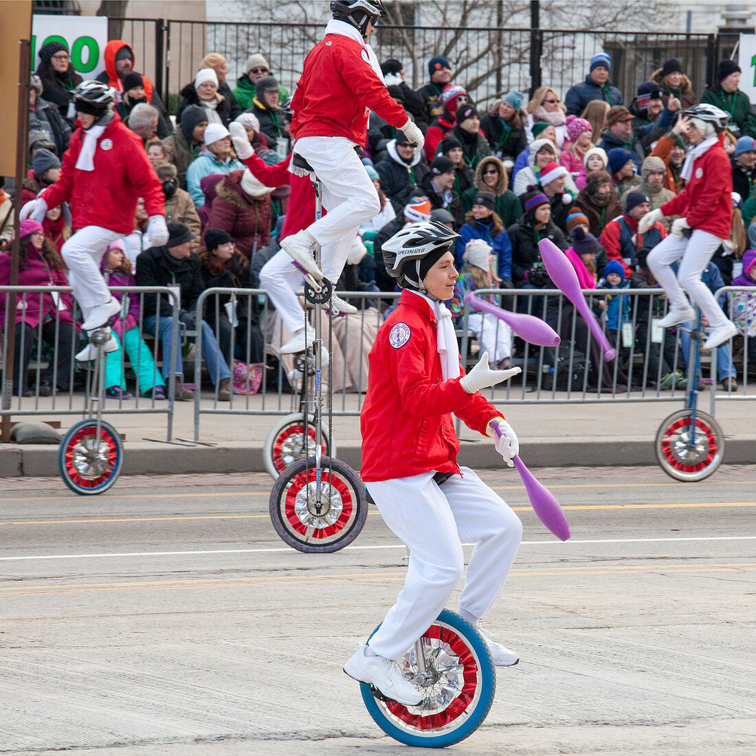 Unicyclists at a parade