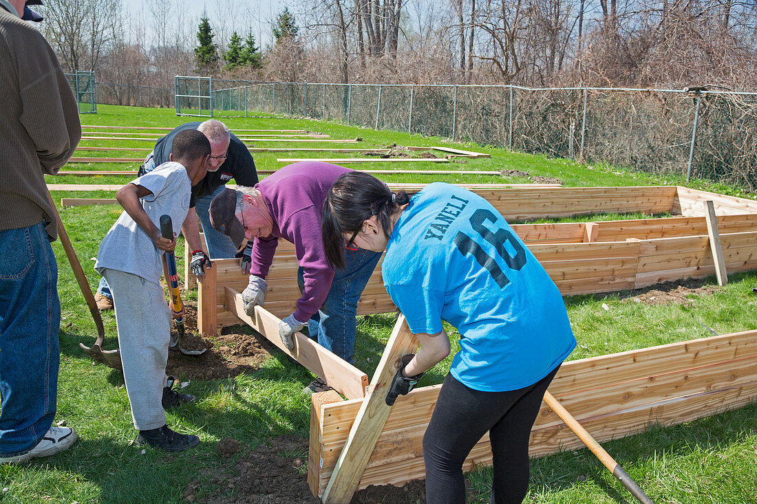 Volunteers building raised beds