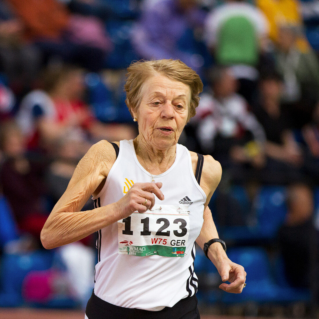 Elderly female athlete in competition