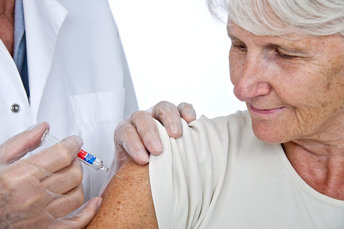 Elderly woman having an injection
