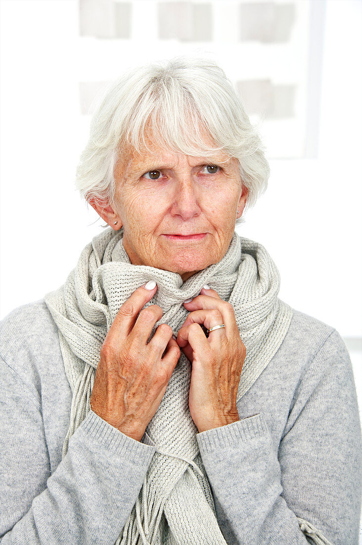 Elderly woman wearing a scarf