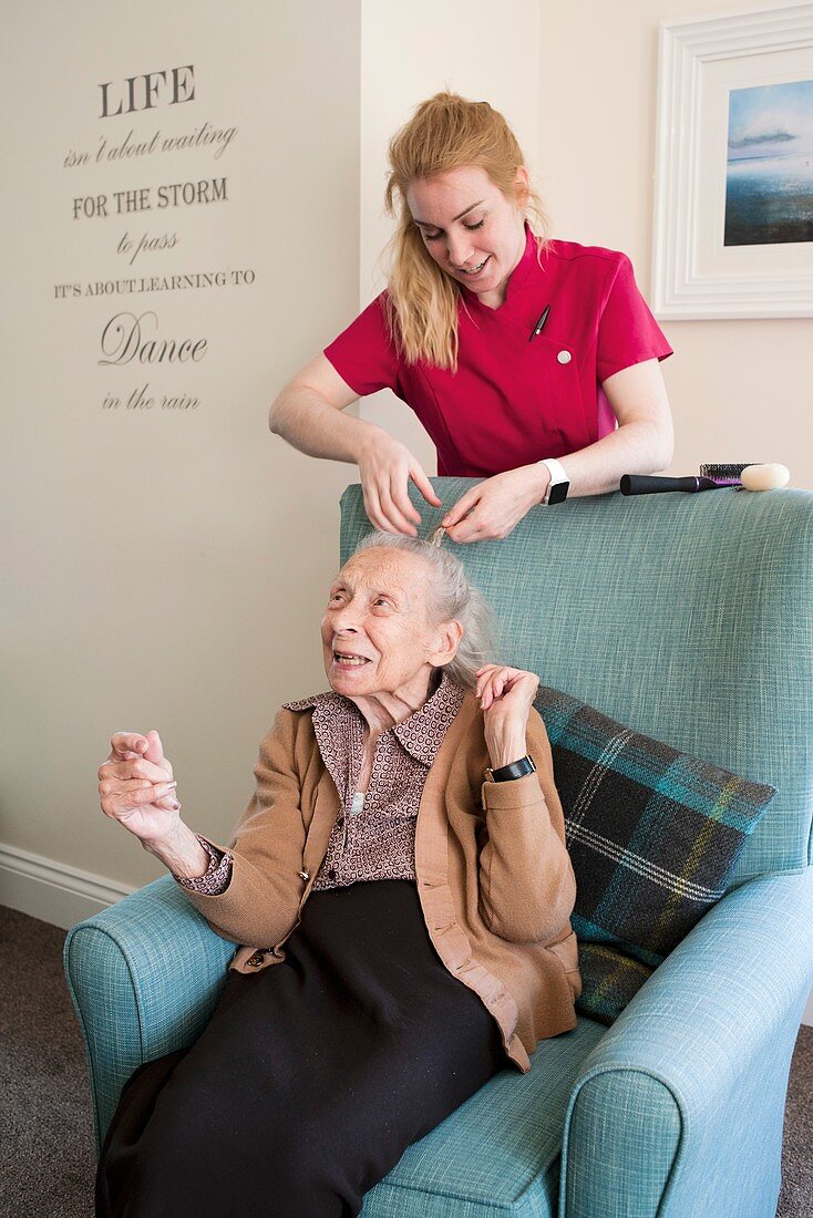 Elderly woman with carer