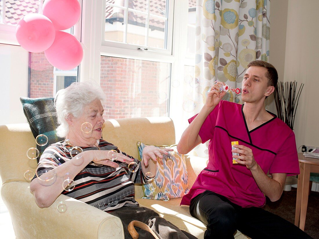 Care assistant with elderly woman
