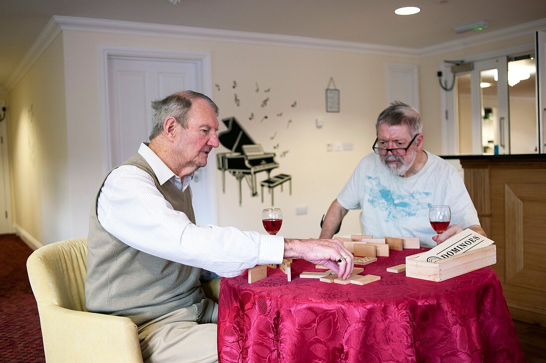 Elderly men playing dominoes