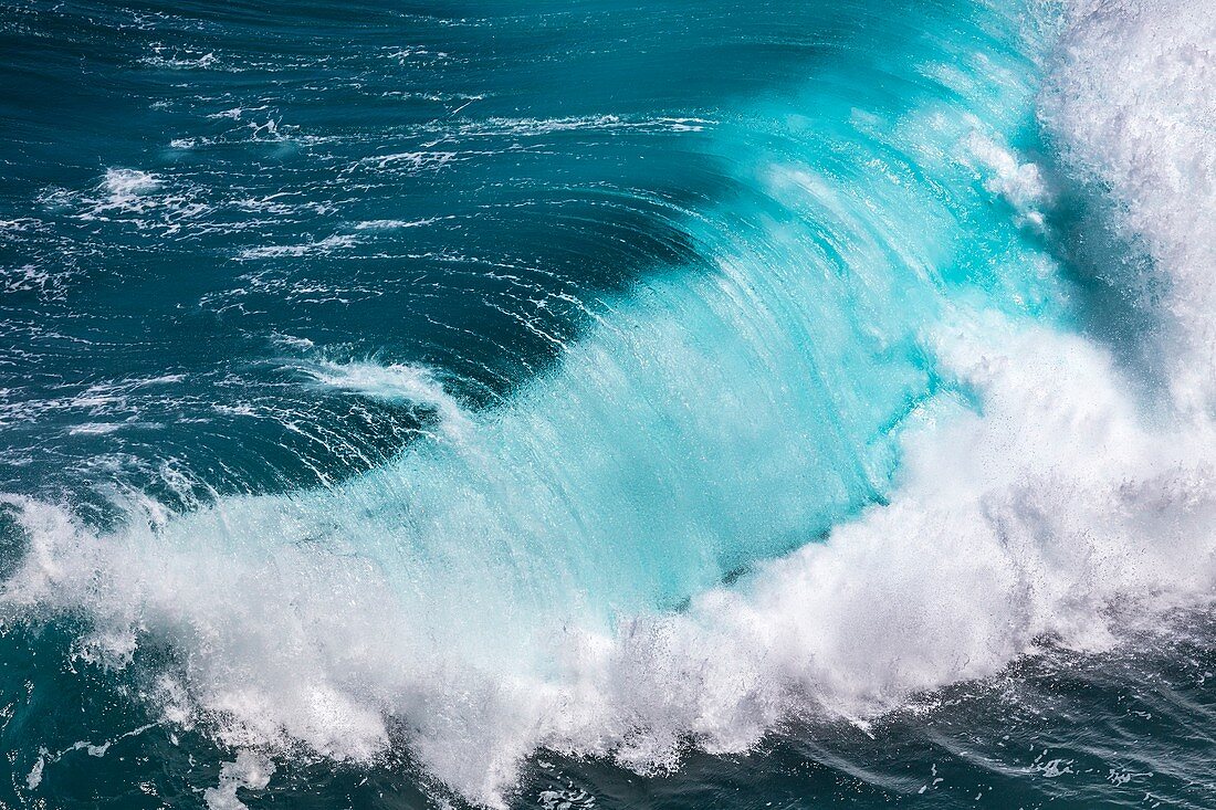 Breaking wave and blue sea