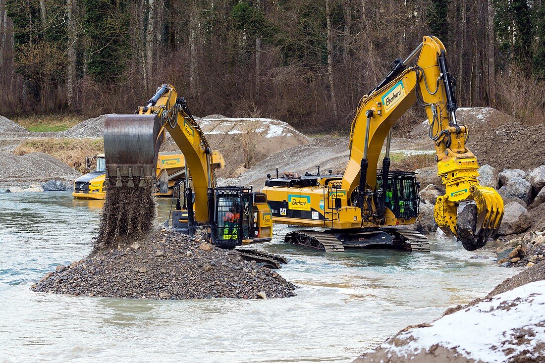 Excavators in Thur river