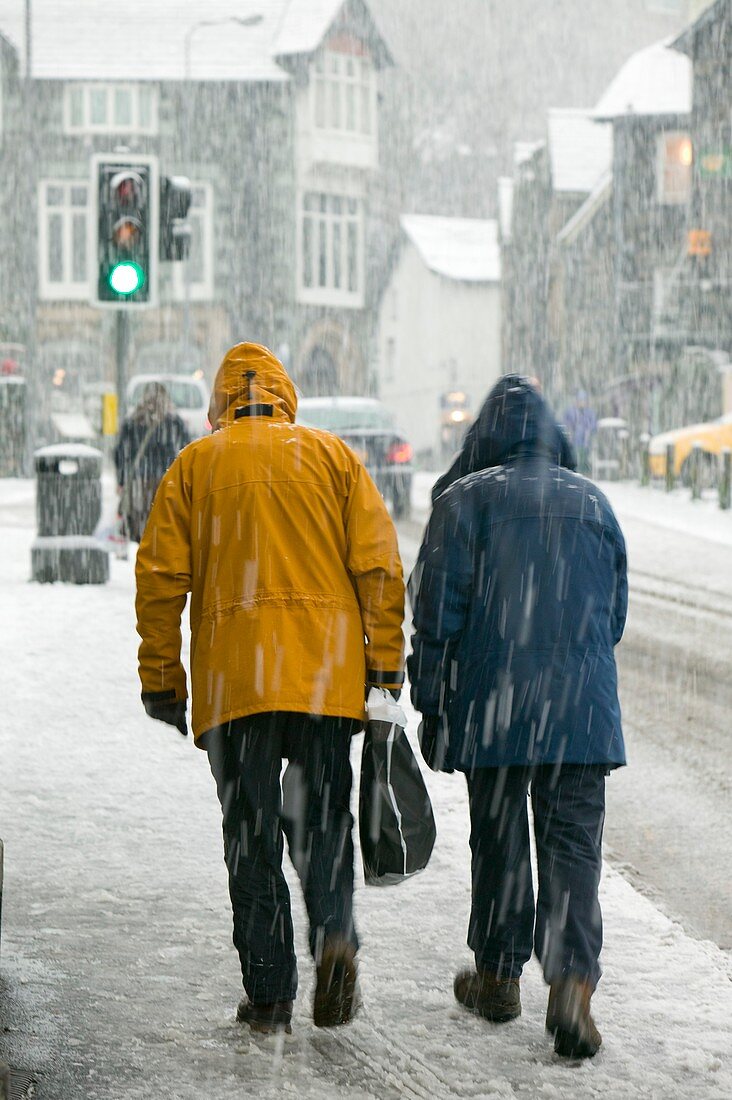Shoppers trudging through snow