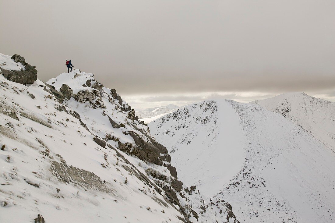 Winter climber ascends An Garbhanach,UK