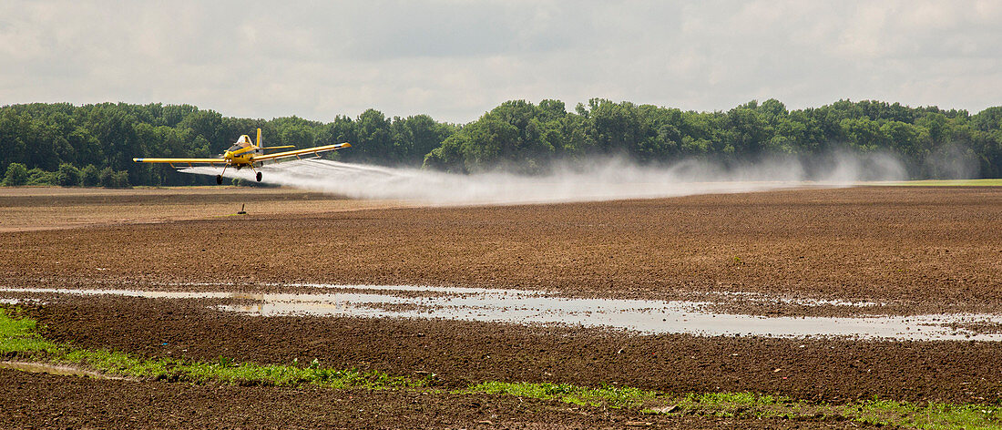 Crop duster spraying pesticides