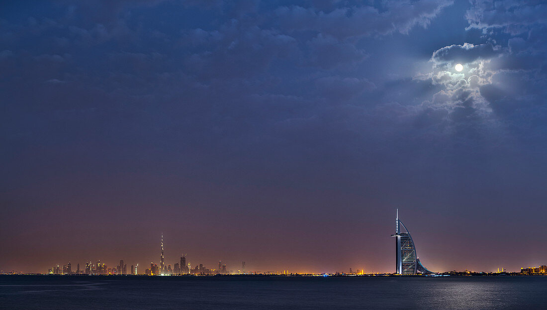 Moon over Dubai skyline