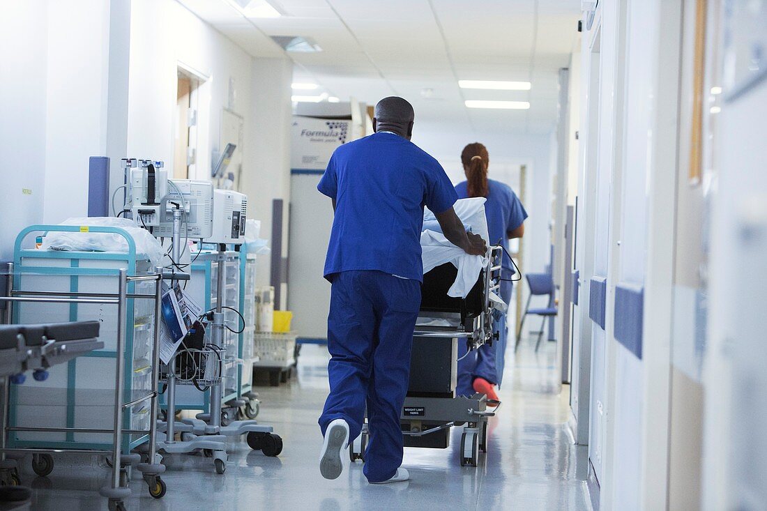 Moving patient in hospital bed