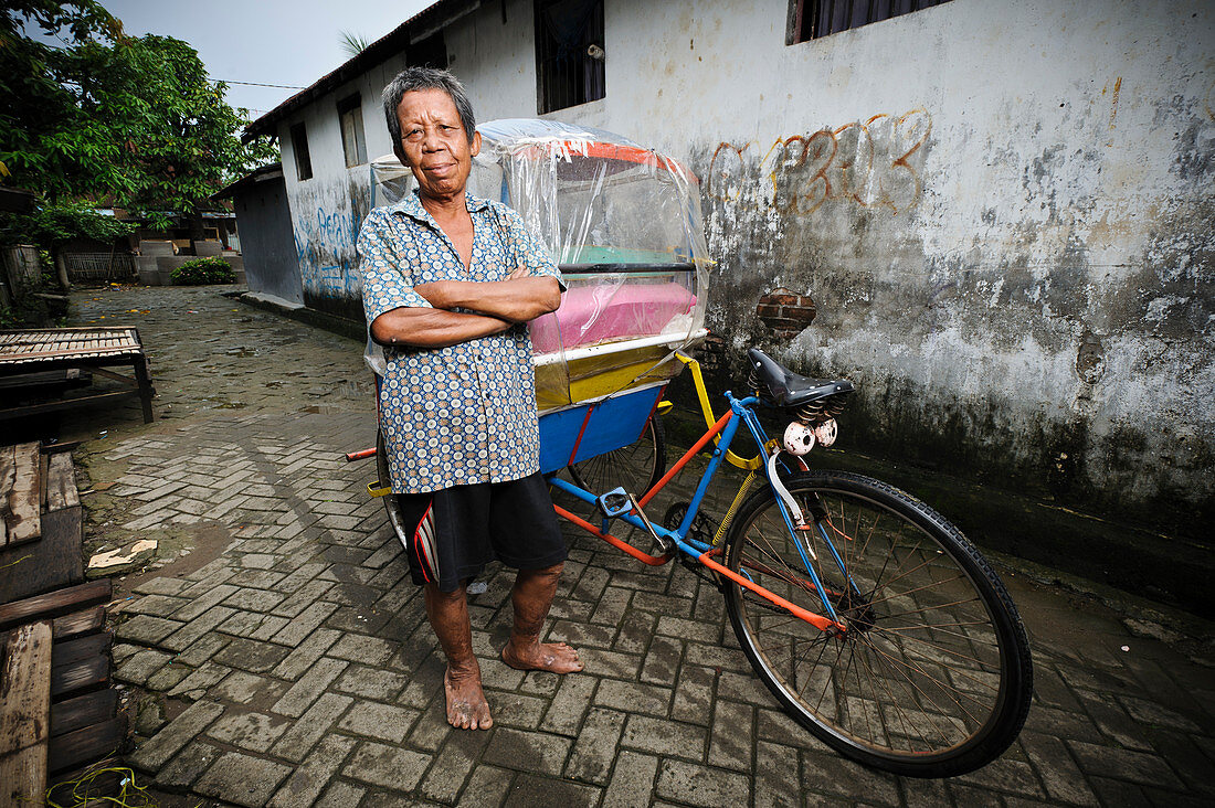 Rickshaw driver with leprosy,Indonesia